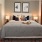 Bedroom with large bed, ensuite. queen bed and nightstands.