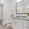 bright bathroom with walk-in closet