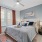 spacious bedroom with bright window