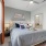 carpeted bedroom with private bathroom