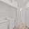 side-by-side washer/dryer units in large closet