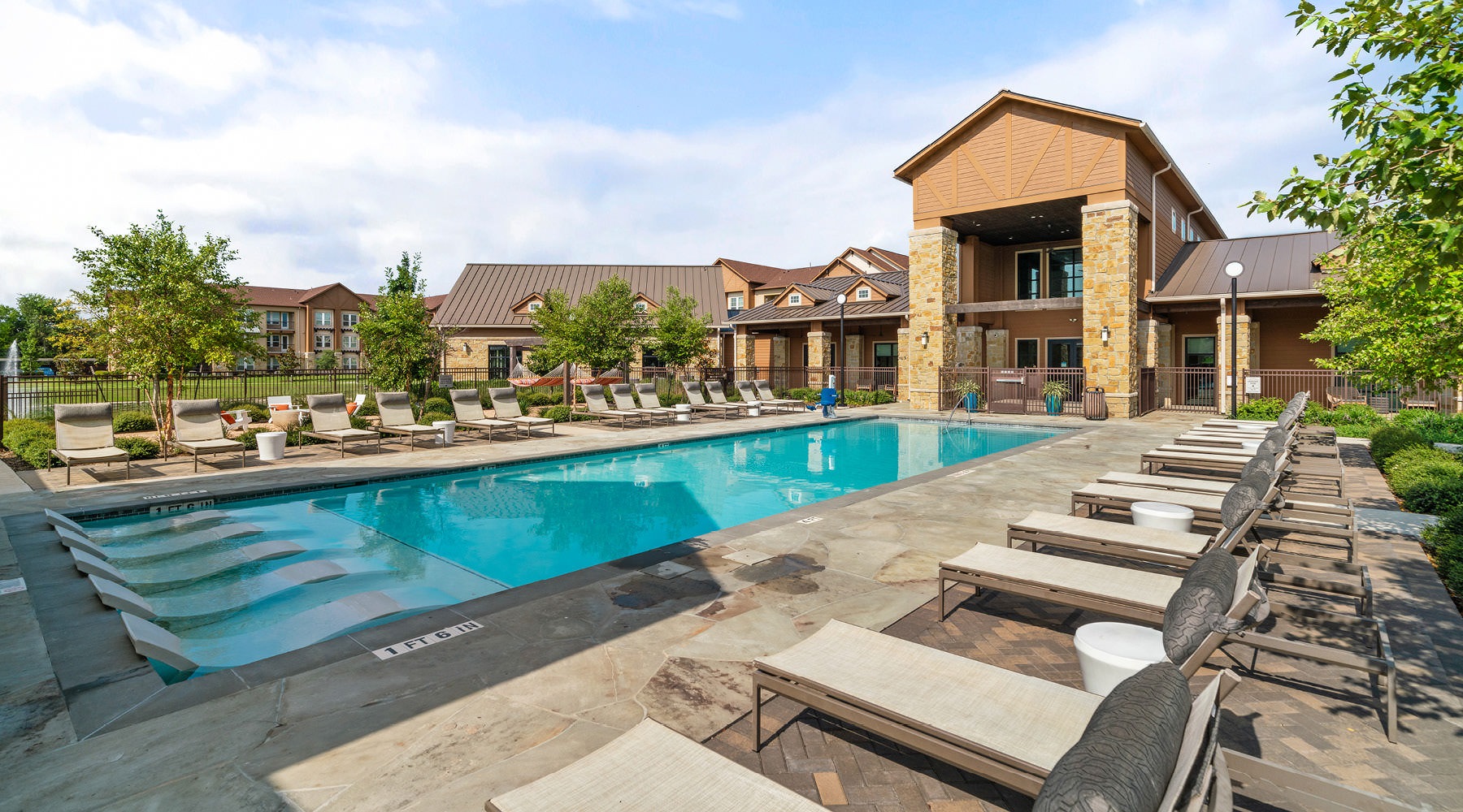 outdoor swimming pool with lounge chairs