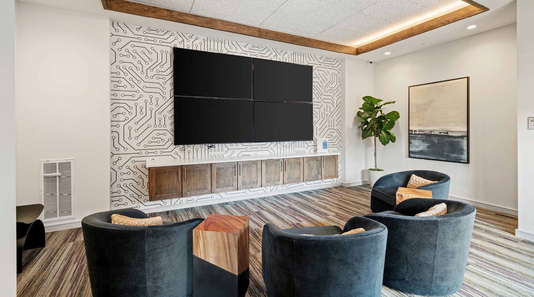 screening room with plush chairs and wall mounted monitors