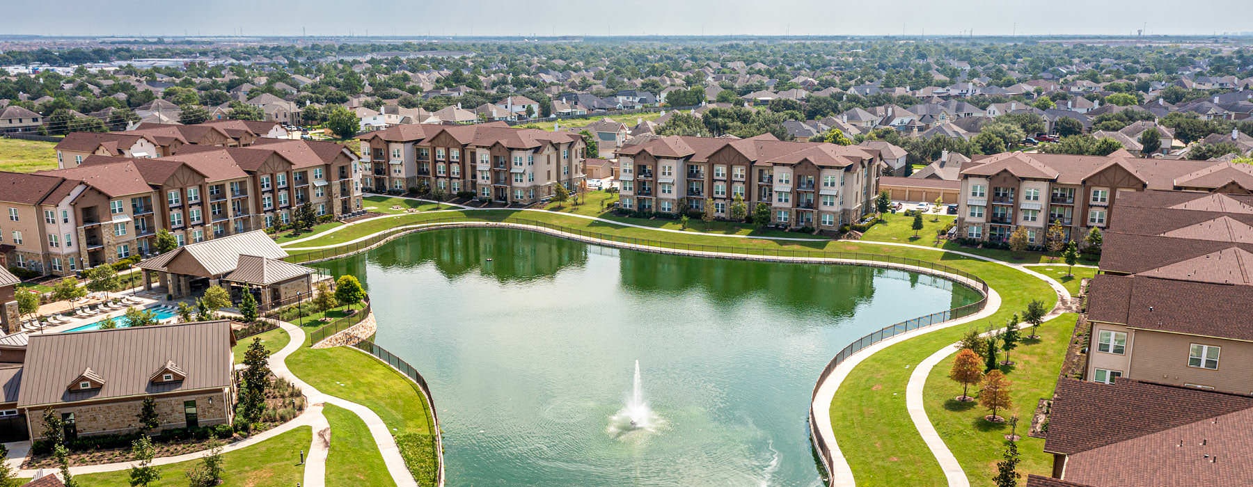 aerial view of pond and property